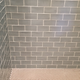 There’s one floor tile that’s slightly off in the picture, that was fixed! And this was taken before the caulking around the pan was completed too.
